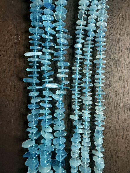 Natural Blue Aquamarine AA   -  Center Drilled Smooth Slice Button w/ Spacers 16"