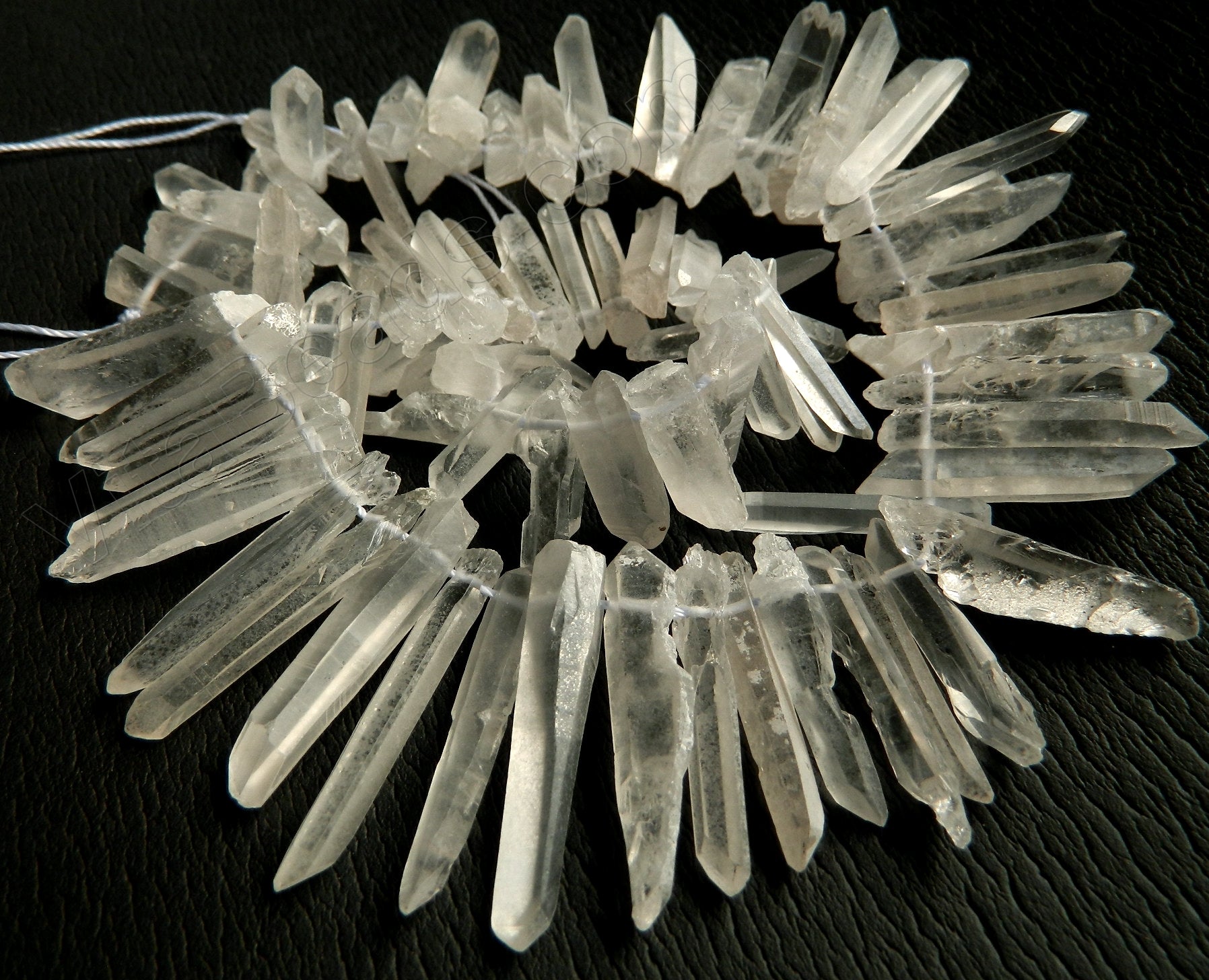 Frosted Crystal Natural  -  Graduated Faceted Tooth  16"     15 - 40 mm